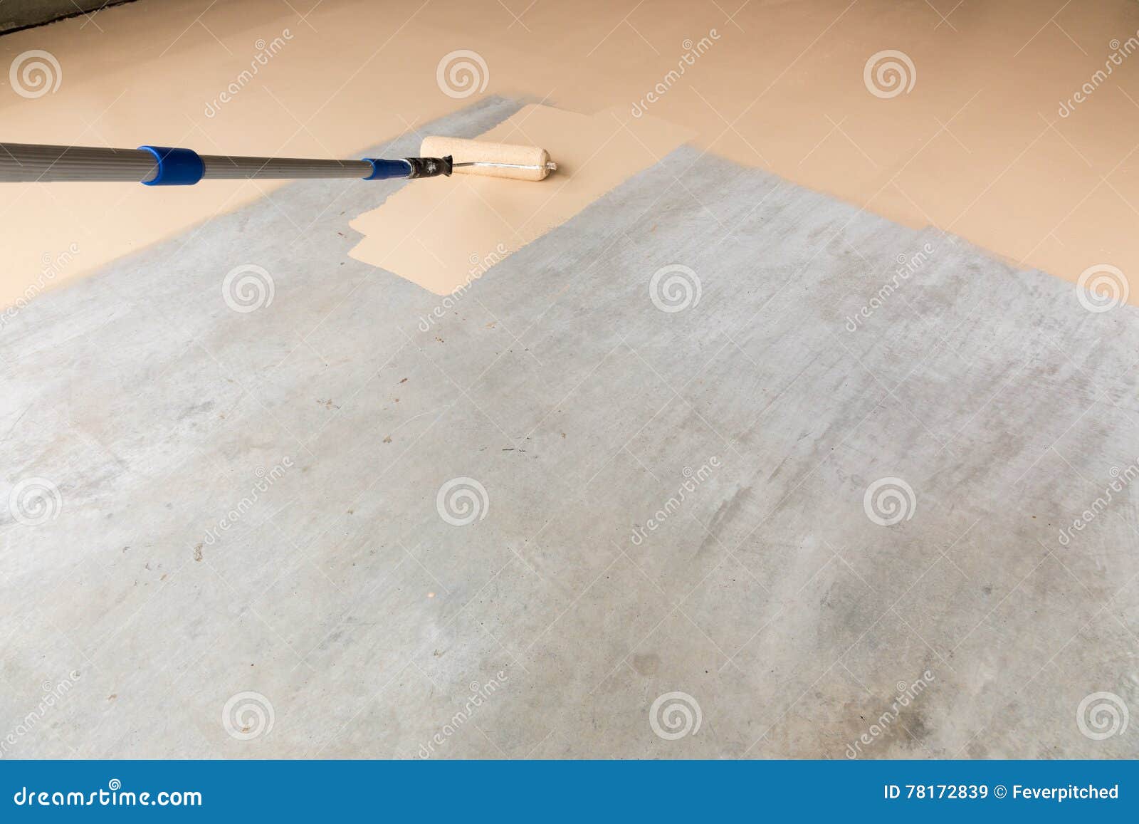 Man Painting The Floor. The Floor Is Painted White With A Roller. Blue Paint Roller, On White