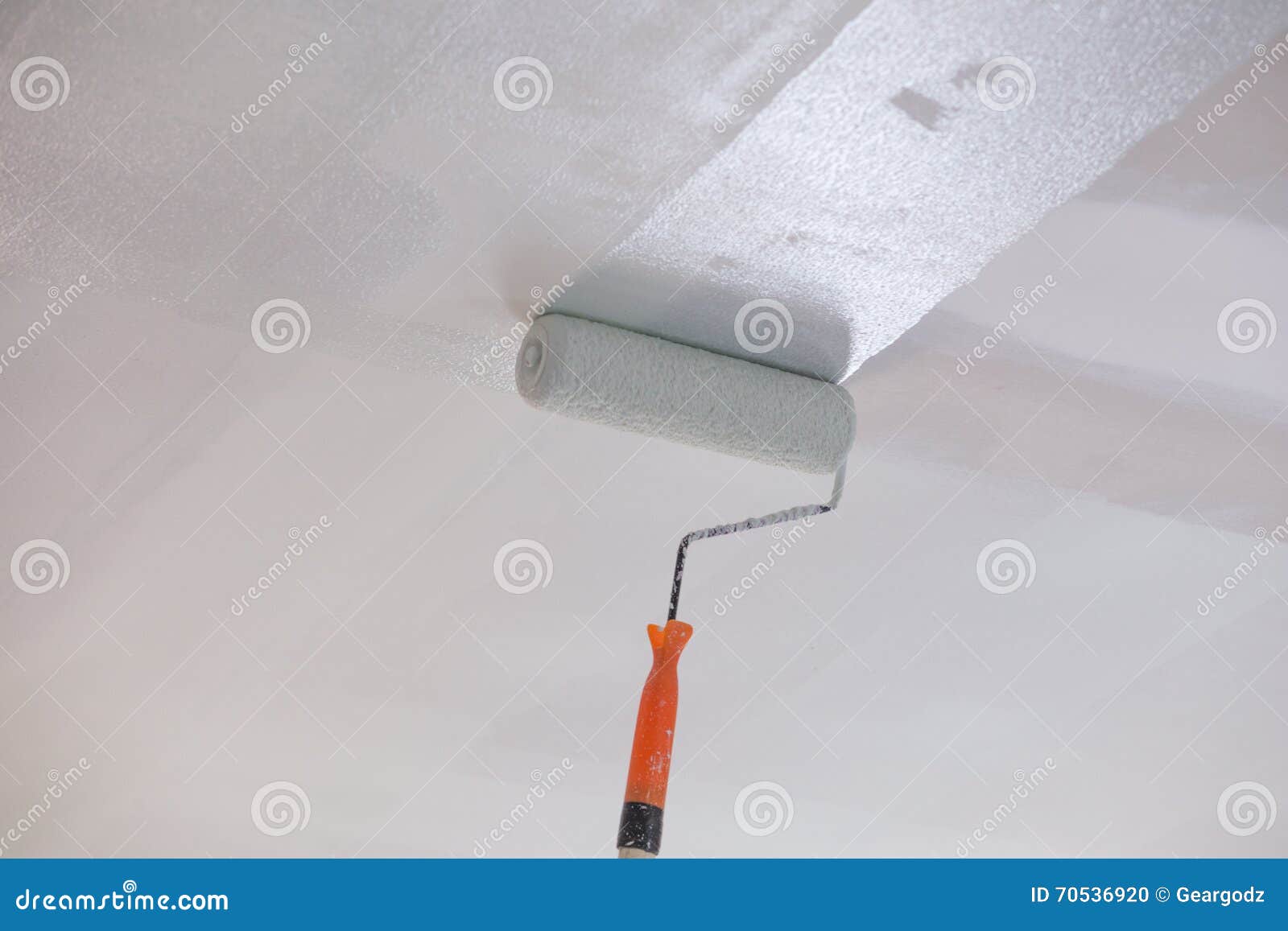 Painting a Gypsum Plaster Ceiling with Roller Stock Photo Image of