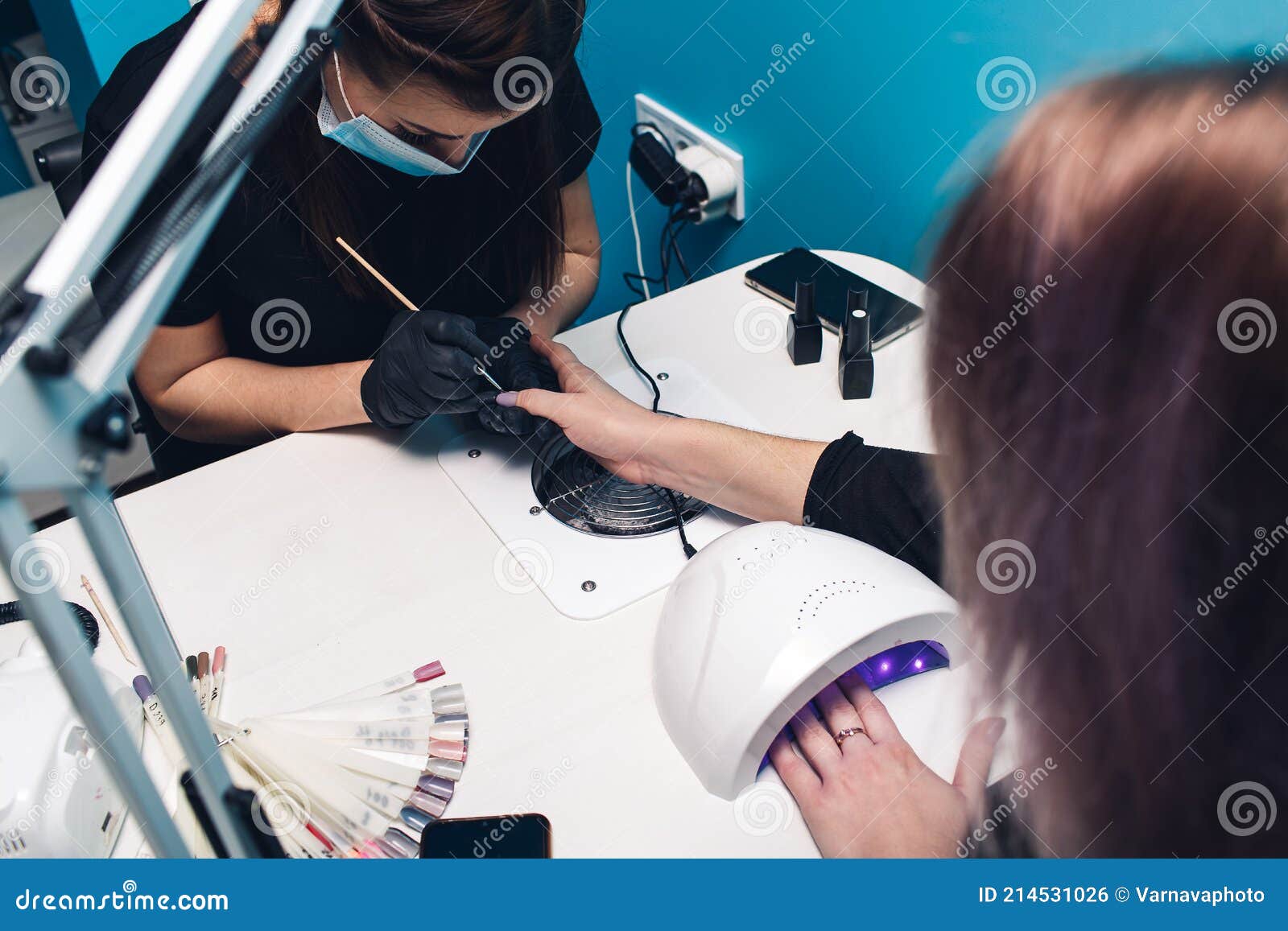 Painting Nails in a Beauty Salon. Manicure Process. Stock Photo Image