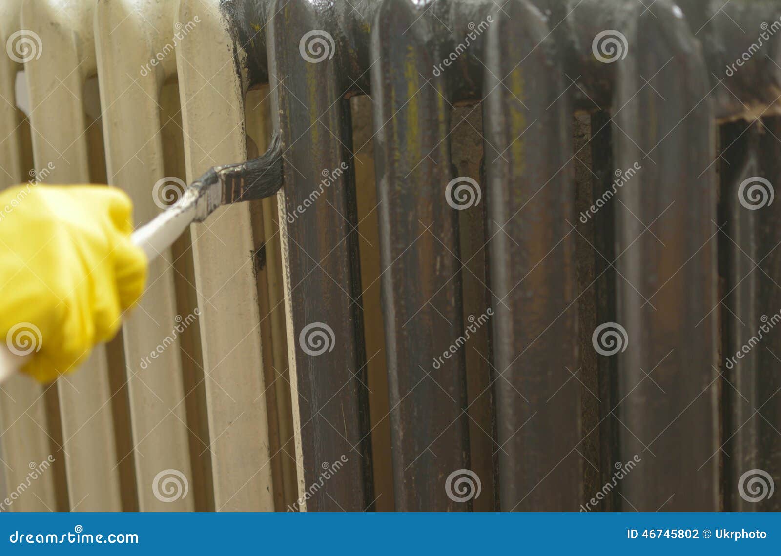 Painting a radiator stock photo. Image of renovation 46745802