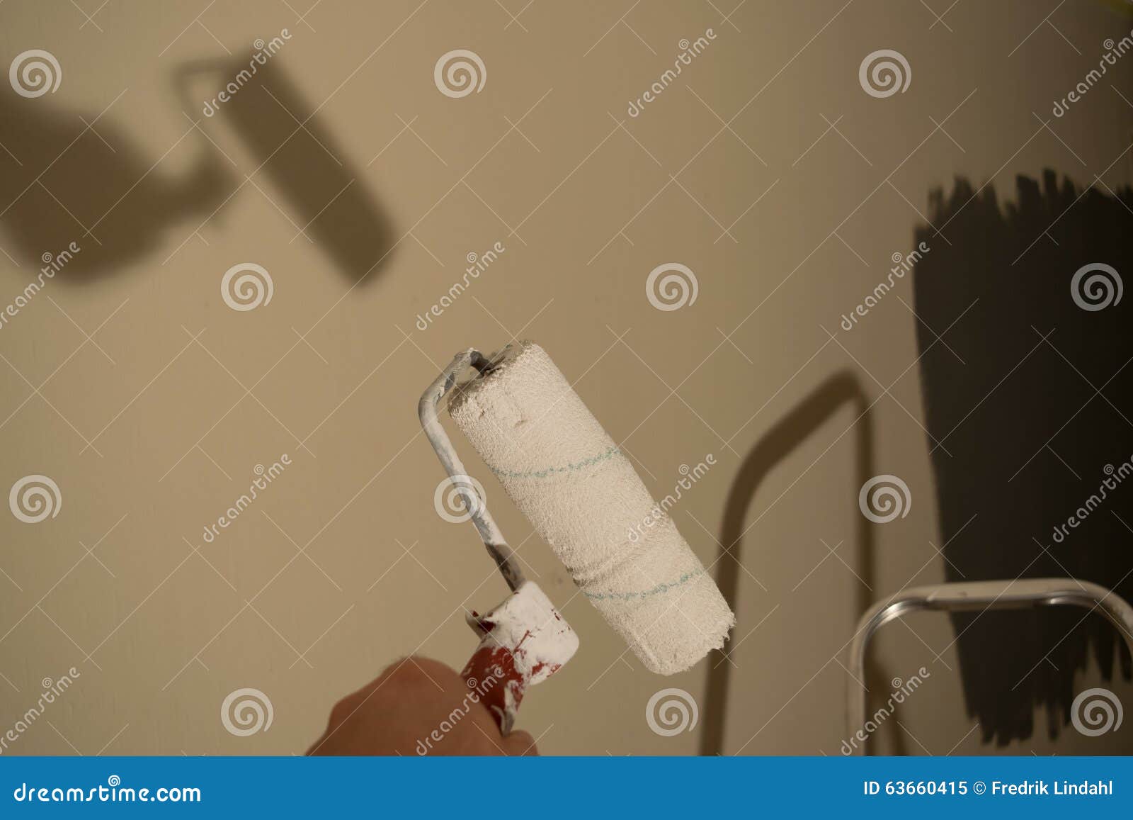 Painting a Wall with Roller Stock Image Image of materials, paint