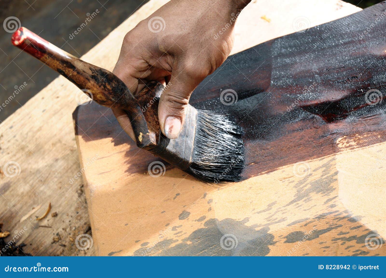 Painting a wood slab stock photo. Image of working, carpentry 8228942