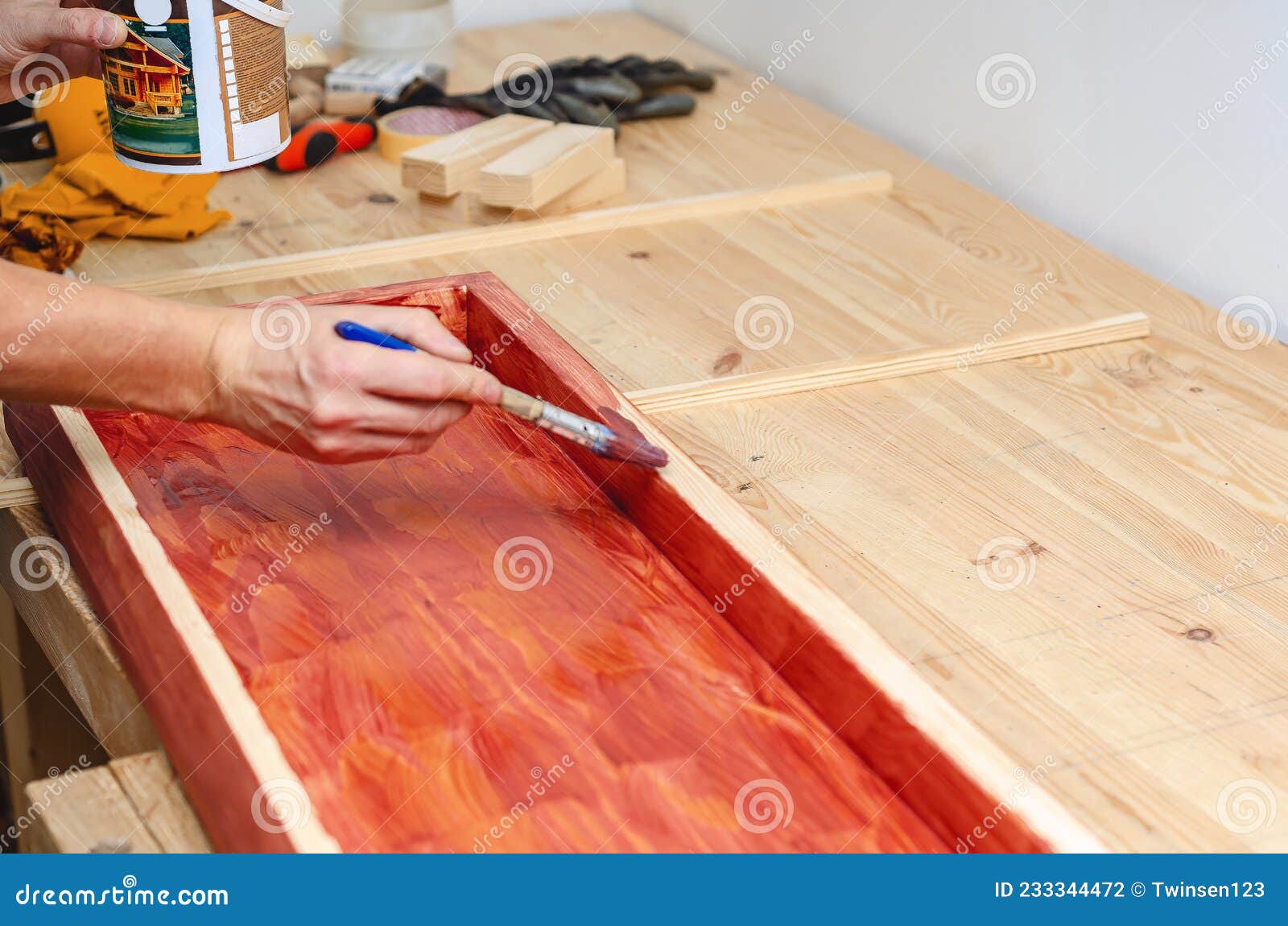 Painting a Wooden Surface with a Brush Stock Photo Image of