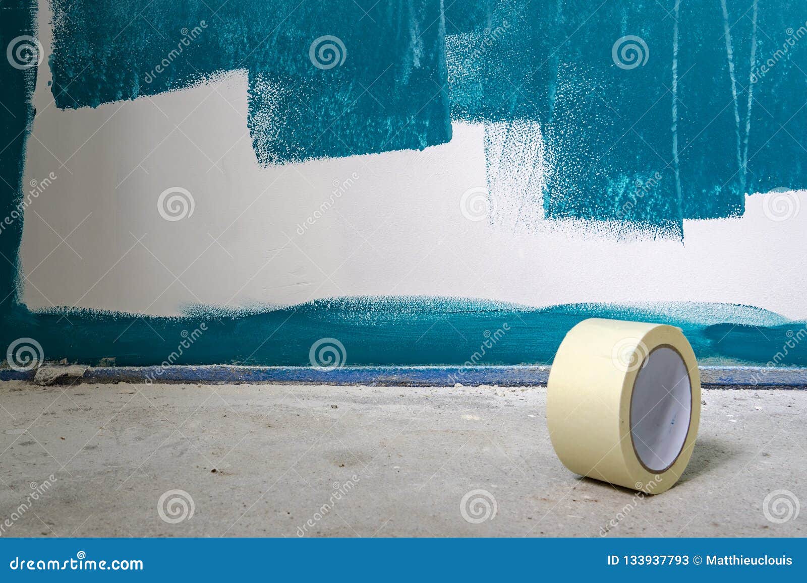 Painting Works on a Wall. with a Roll of Duct Tape in the Foreground