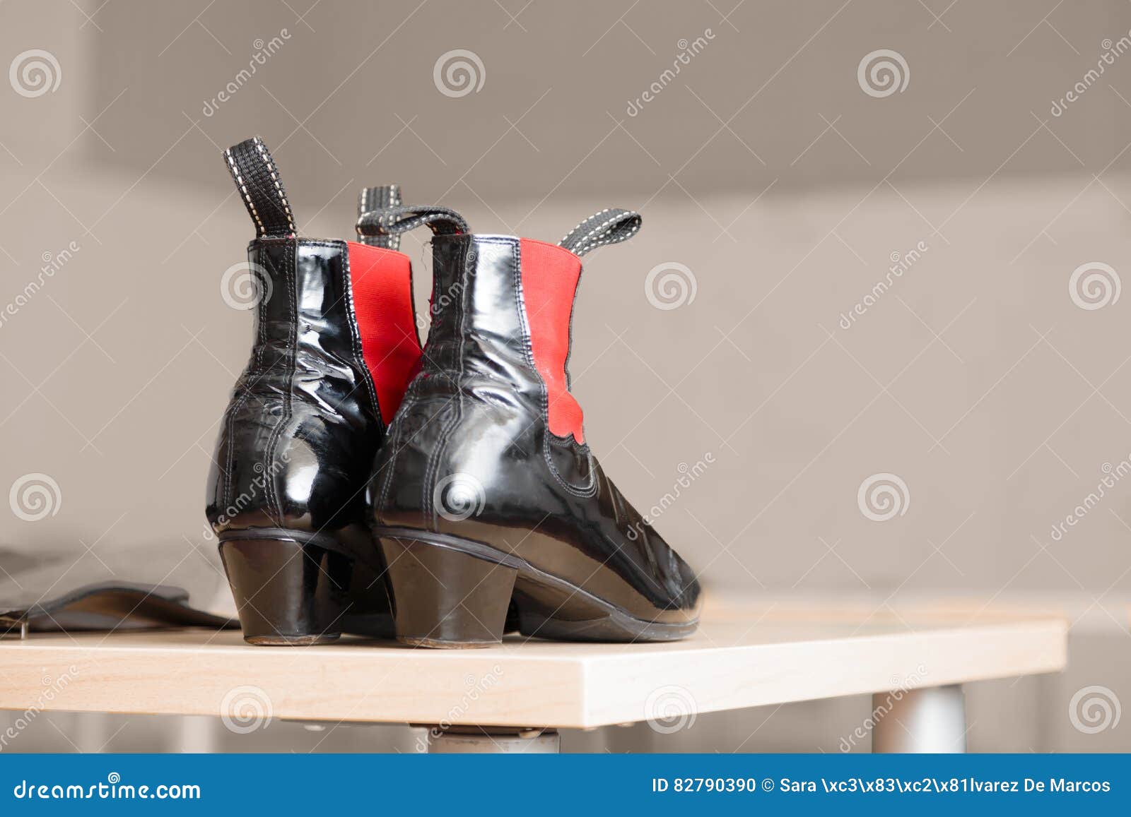 Pair of Black Leather Boots with Red Accents Stock Photo - Image of ...
