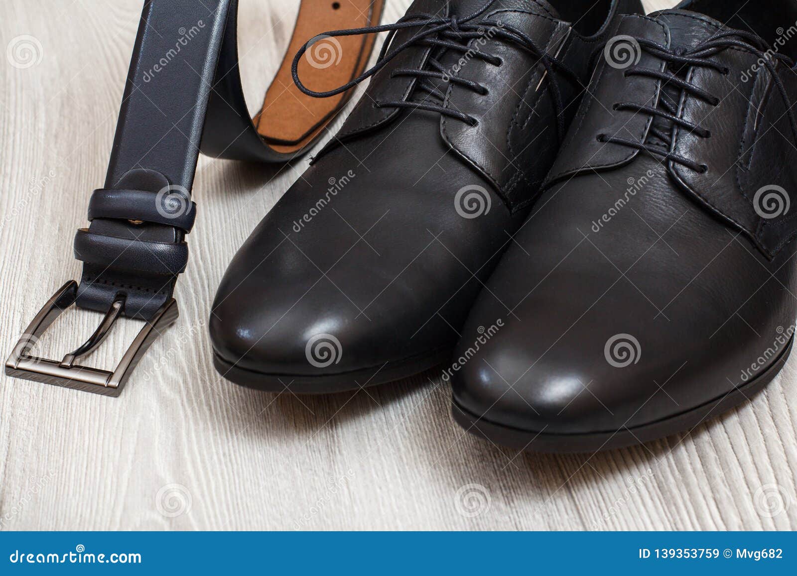 Pair of Black Leather Men`s Shoes and Leather Belt for Men on Wooden ...