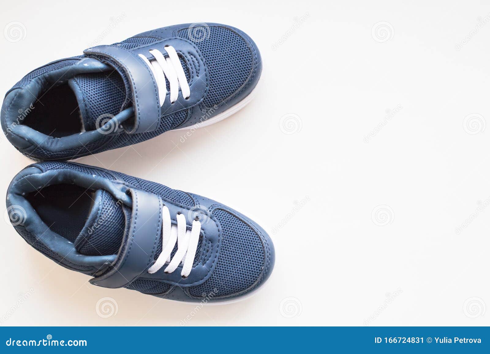 Pair of Blue Running Shoes Isolated on a Pastel Background. Trendy ...