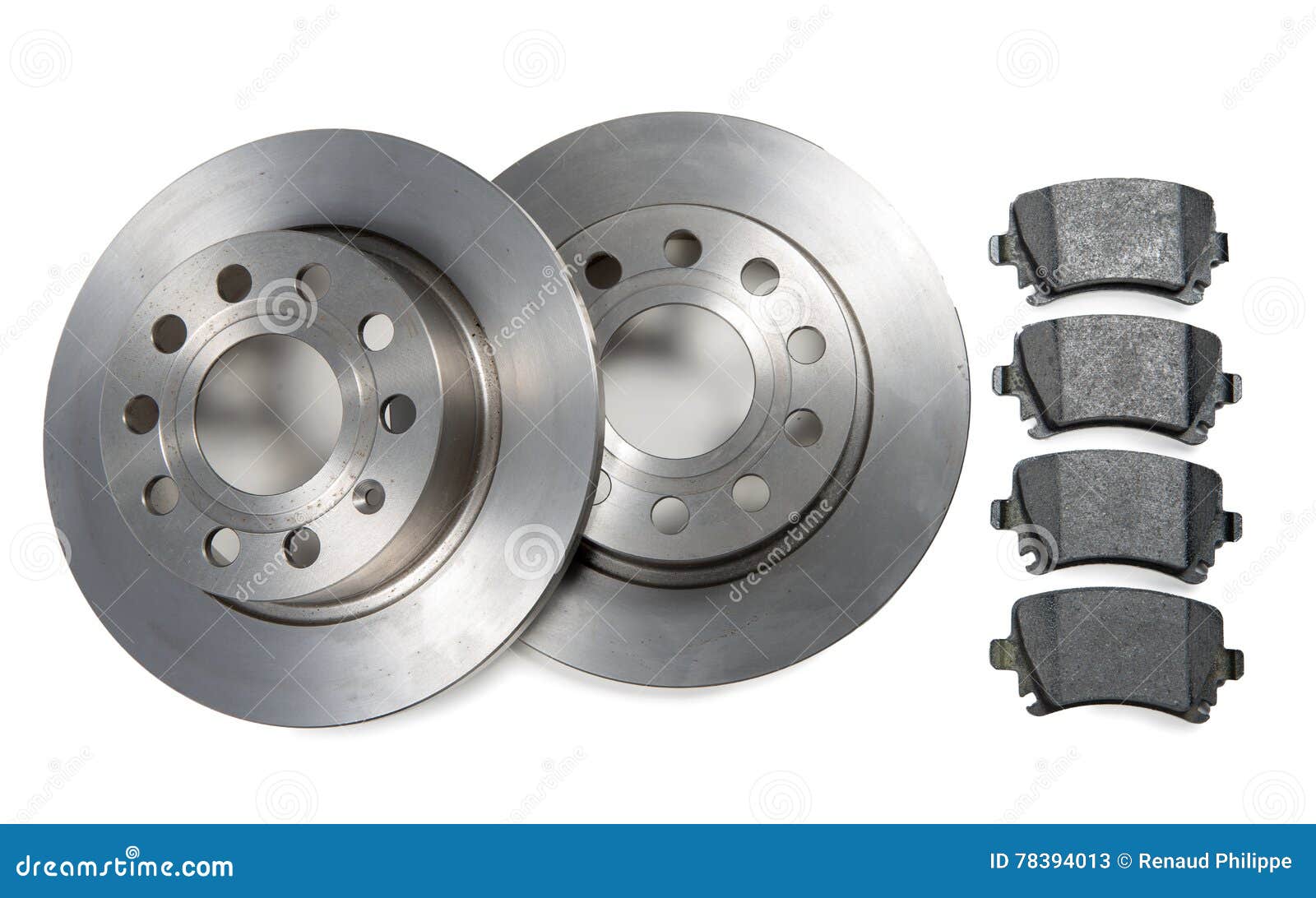 pair of car brake discs and pads on white background