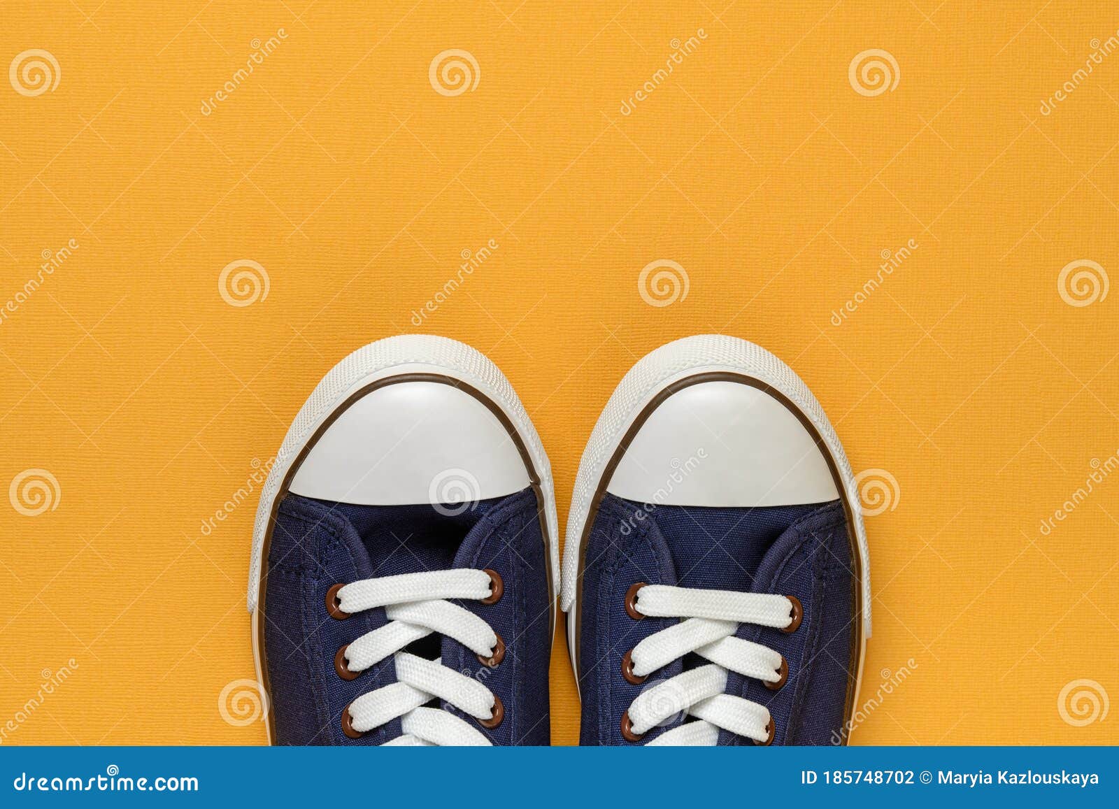 Pair of Classic Blue Sneakers or Gumshoes with White Shoe Laces on a ...