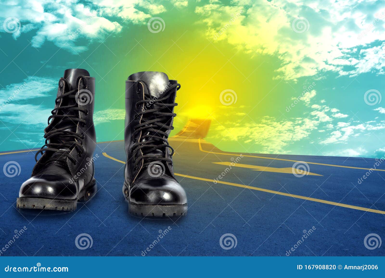 A Pair of Combat Boots on an Asphalt Road . Concept for Hard Work Stock
