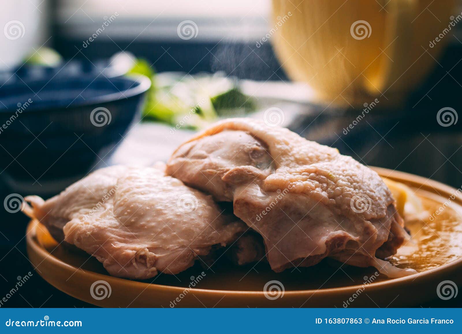 A Pair of Cooked Chicken Thigh Steaming in a Plate Stock Image Image