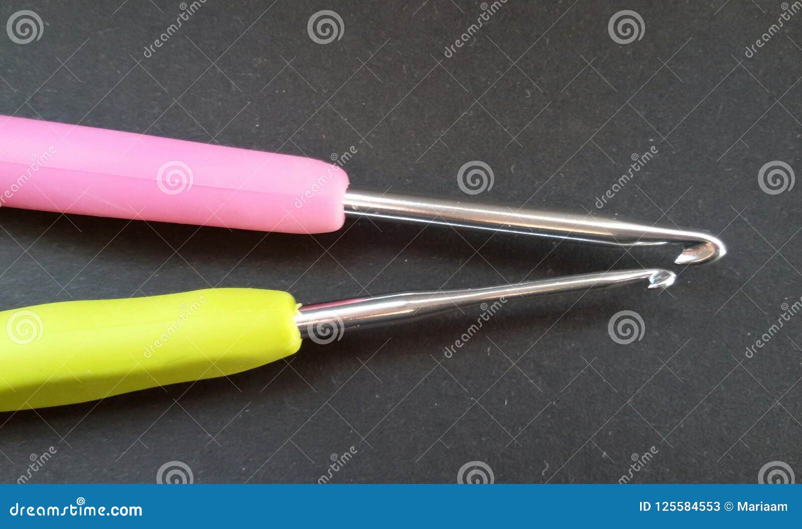 Two Crochet Hooks. a Small One and a Big One. Needles Over Black  Background. Stock Image - Image of small, needle: 125584553