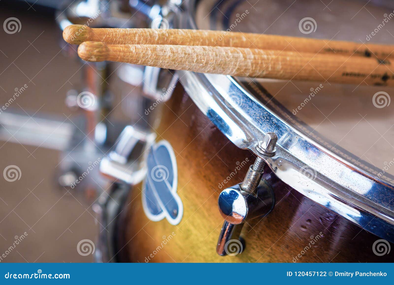 Pair of Drumsticks Lying on Tomtom Drum. Stock Photo Image of
