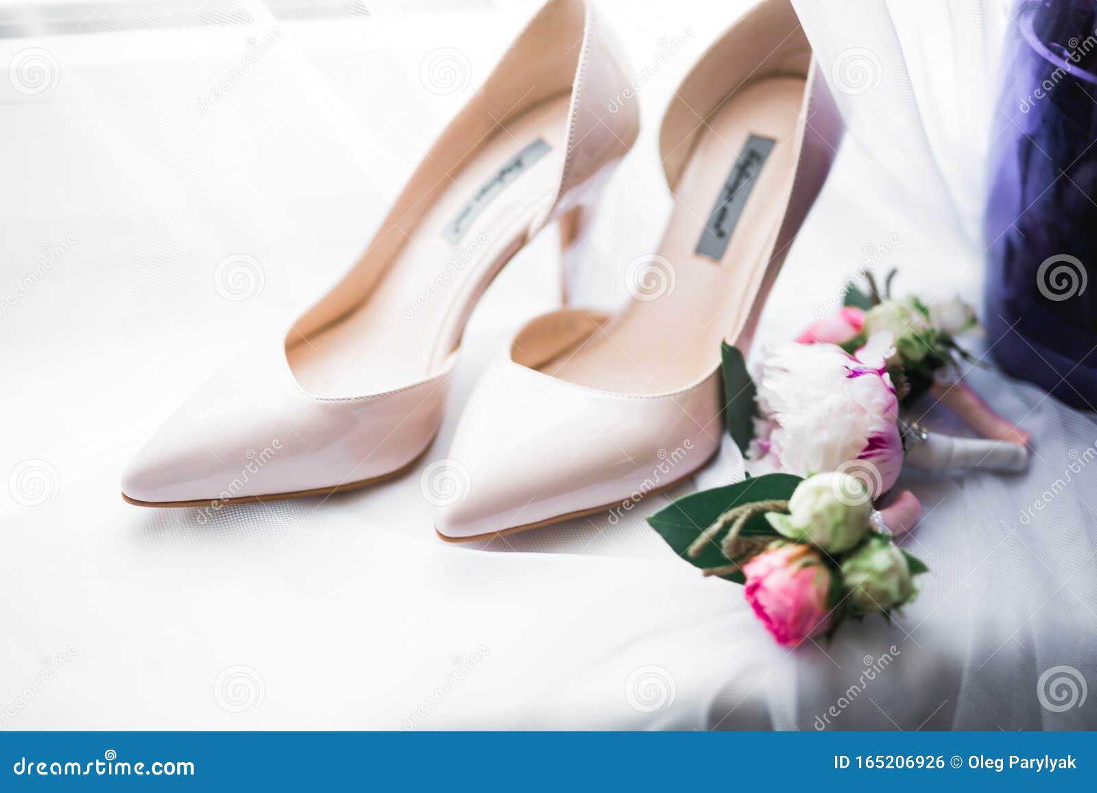Pair of Elegant and Stylish Bridal Shoes with a Bouquet with Roses and ...