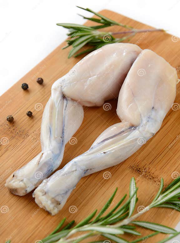 Pair of Fresh Frog Legs on White Background Stock Image - Image of