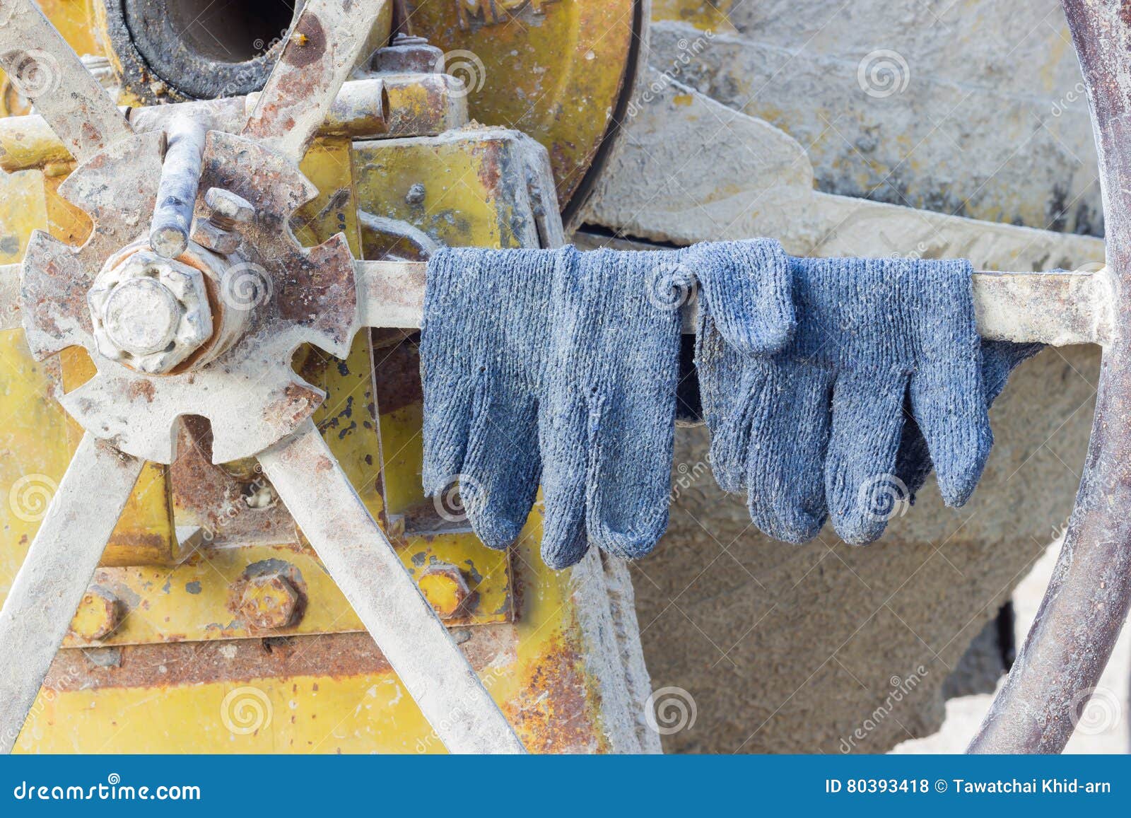 Pair of Gloves on the Cement Mixer in the Construction Site, Horizontal