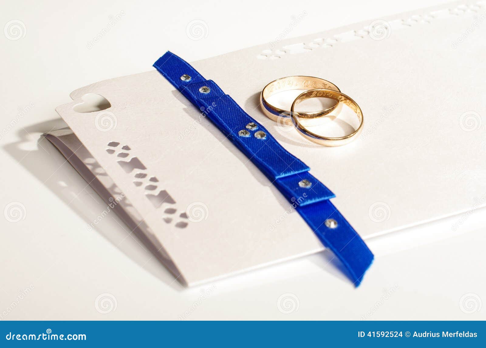 Pair of Gold Rings on the Wedding Invitation Stock Photo Image of