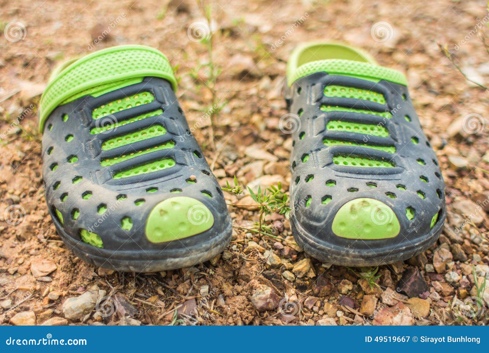 pair green slippers dirty soil scene thailand 49519667