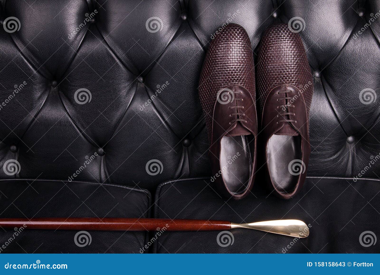 Men Brown Woven Leather Shoes and Wooden Shoe Spoon Stock Image - Image ...