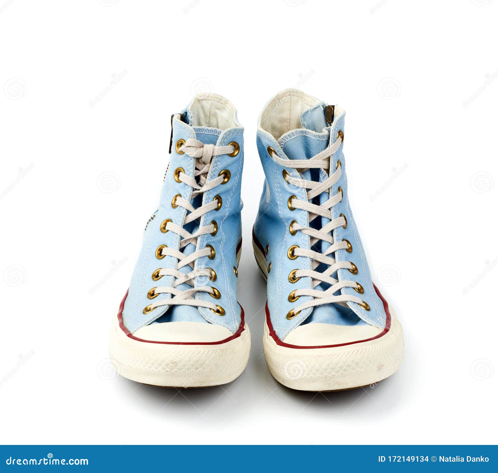 Pair of Light Blue Worn Textile Sneakers with Laces and Zippers on a ...