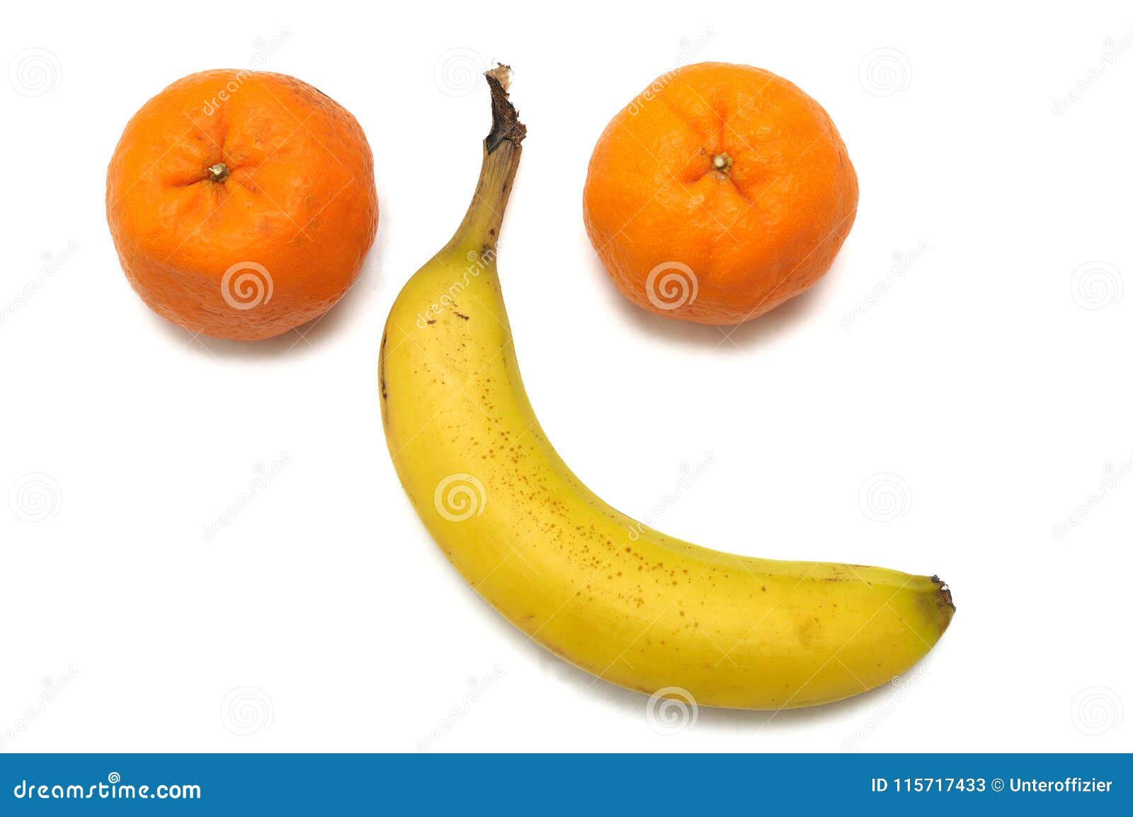 A Pair of Mandarin Oranges and a Single Banana Arranged in the Shape of