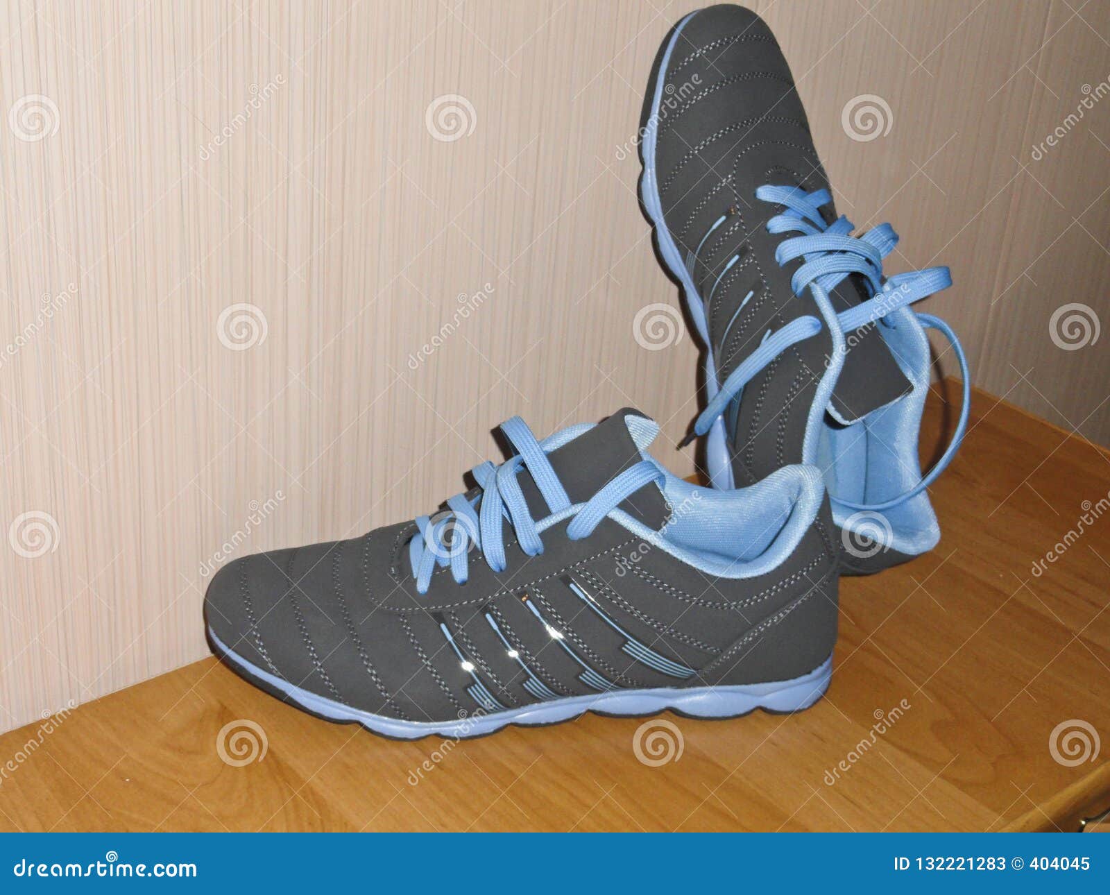 A Pair of New Sneakers on the Cabinet. Stock Image - Image of shoelace ...