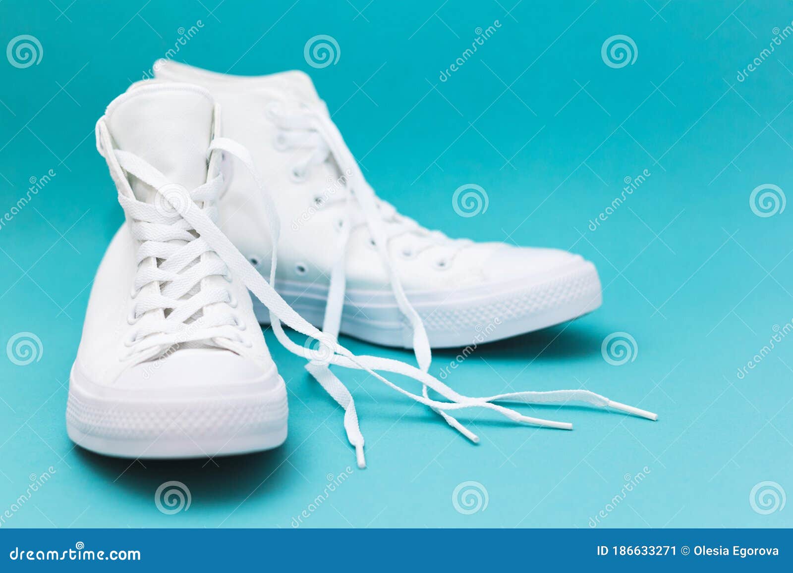 Pair of New White Sneakers on Blue Background Stock Image - Image of ...