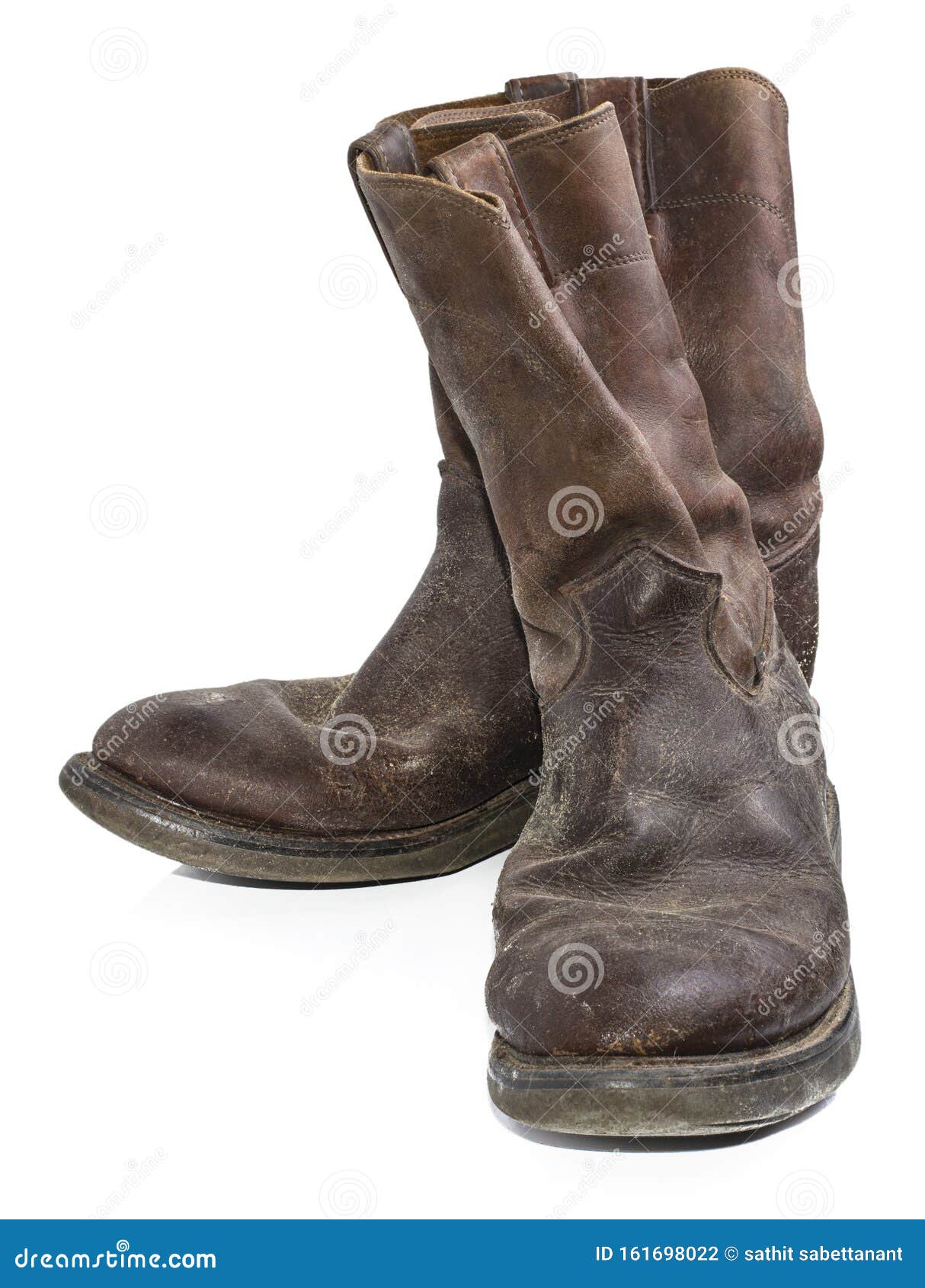 A Pair of Old, Dirty, Brown Cowboy Boots that are Separated Stock Photo Image of boots, heel