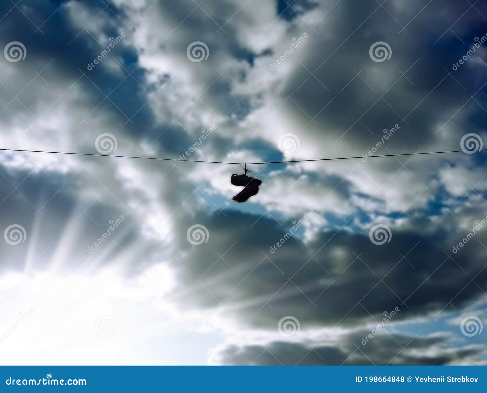 Sports shoes are hanging on wires.Sneakers suspended by laces on electrical  wires. 9199417 Stock Photo at Vecteezy