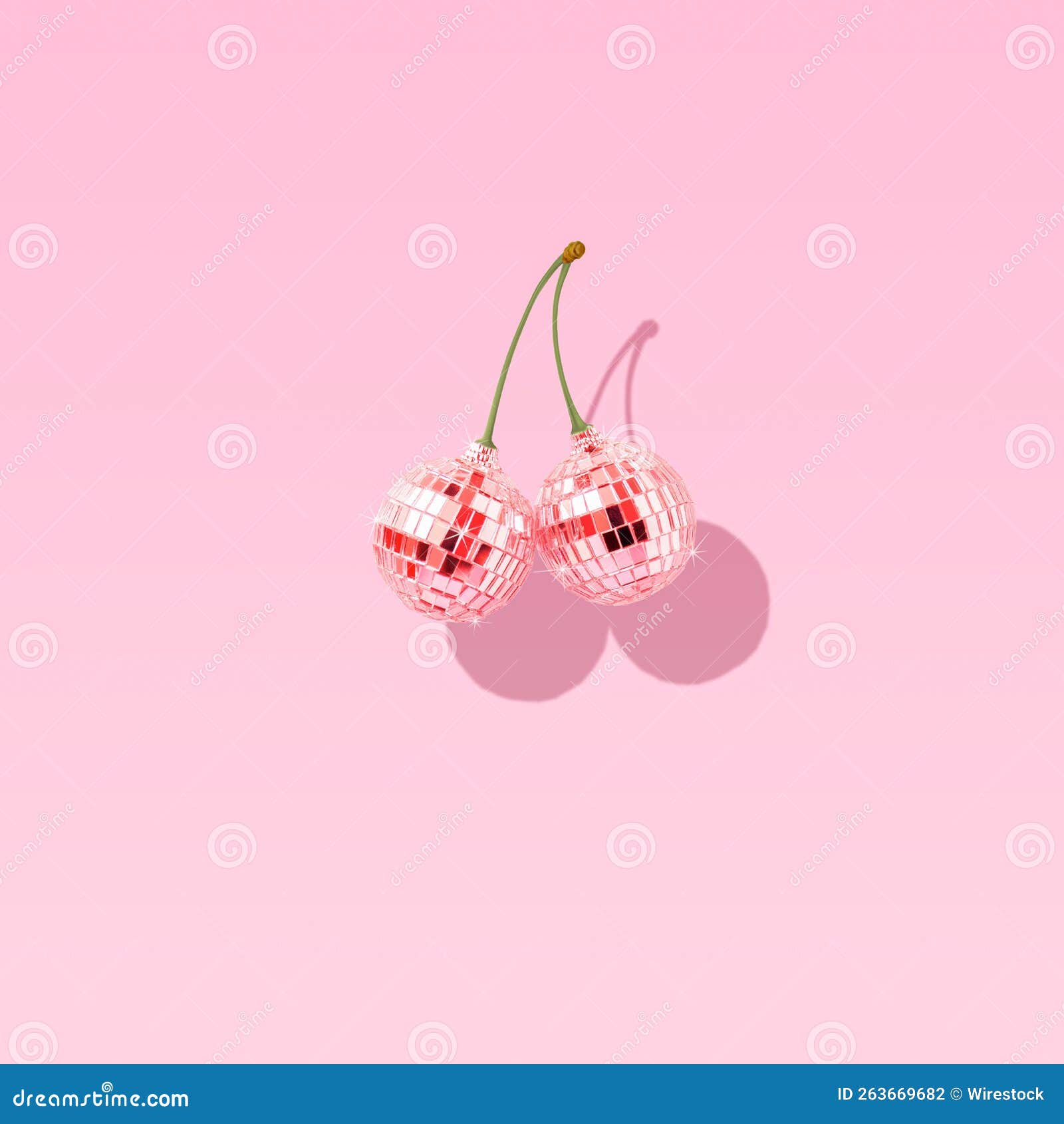 Pair of Pink Disco Balls Like Cherries on Blue Background Stock Photo
