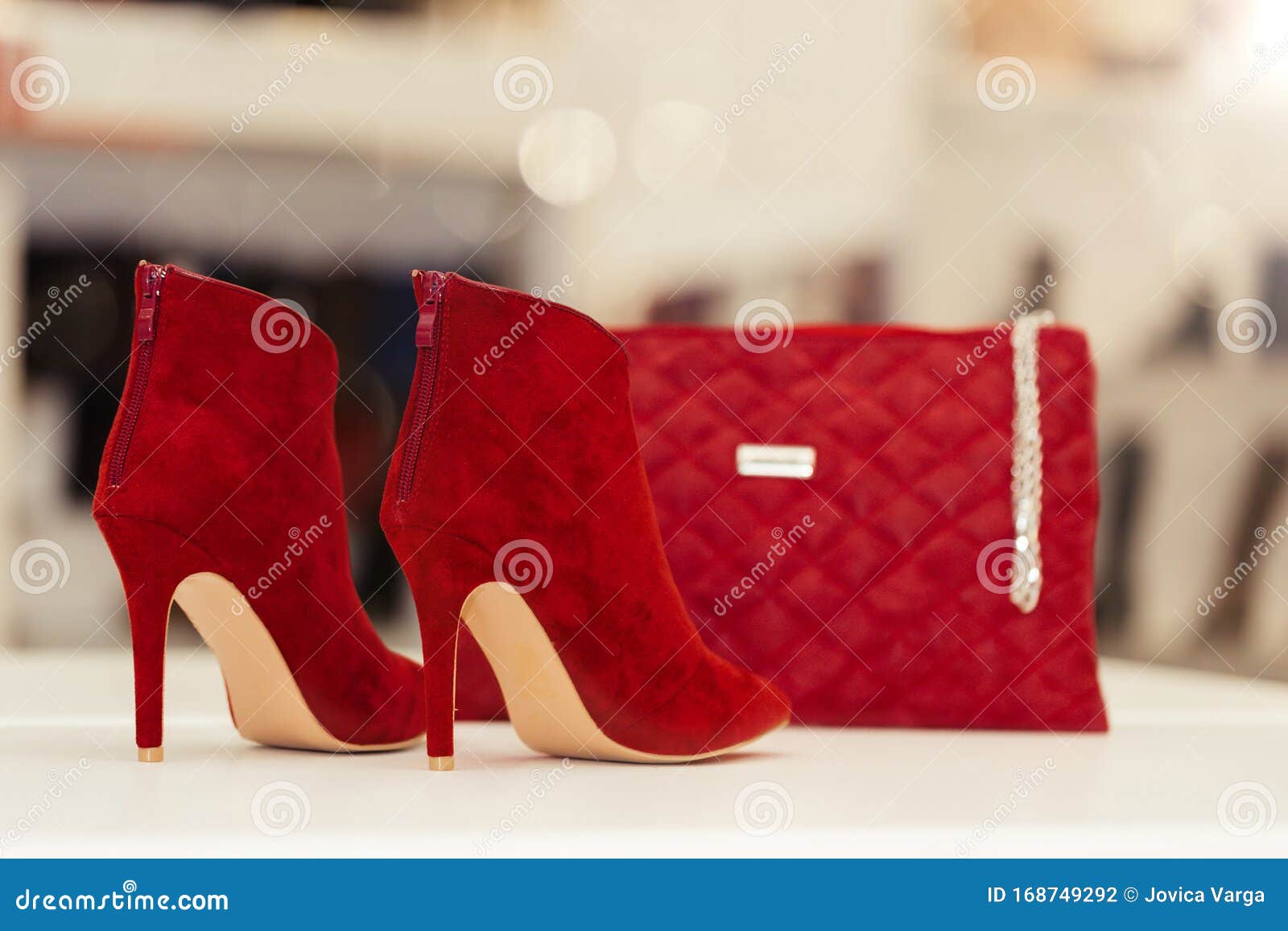 Pair of Red Fashionable Leather Shoes High Heels and Purse on the Shelf at the Store Stock Photo - of leather, heels: 168749292