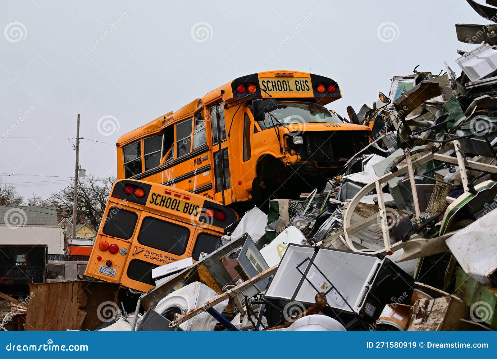 pair-school-buses-top-huge-pile-scrap-metal-junkyard-bus-looks-out-place-271580919.jpg