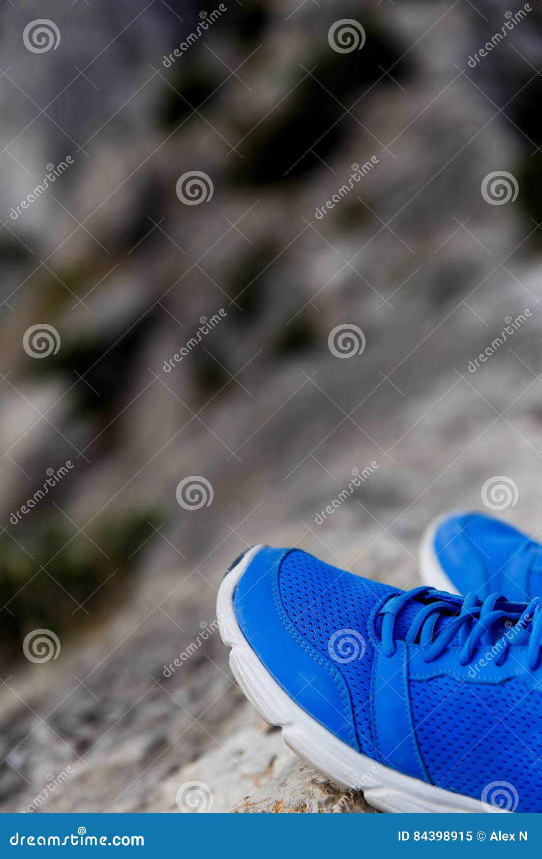 Pair of shoes on mountains stock image. Image of healthy 84398915