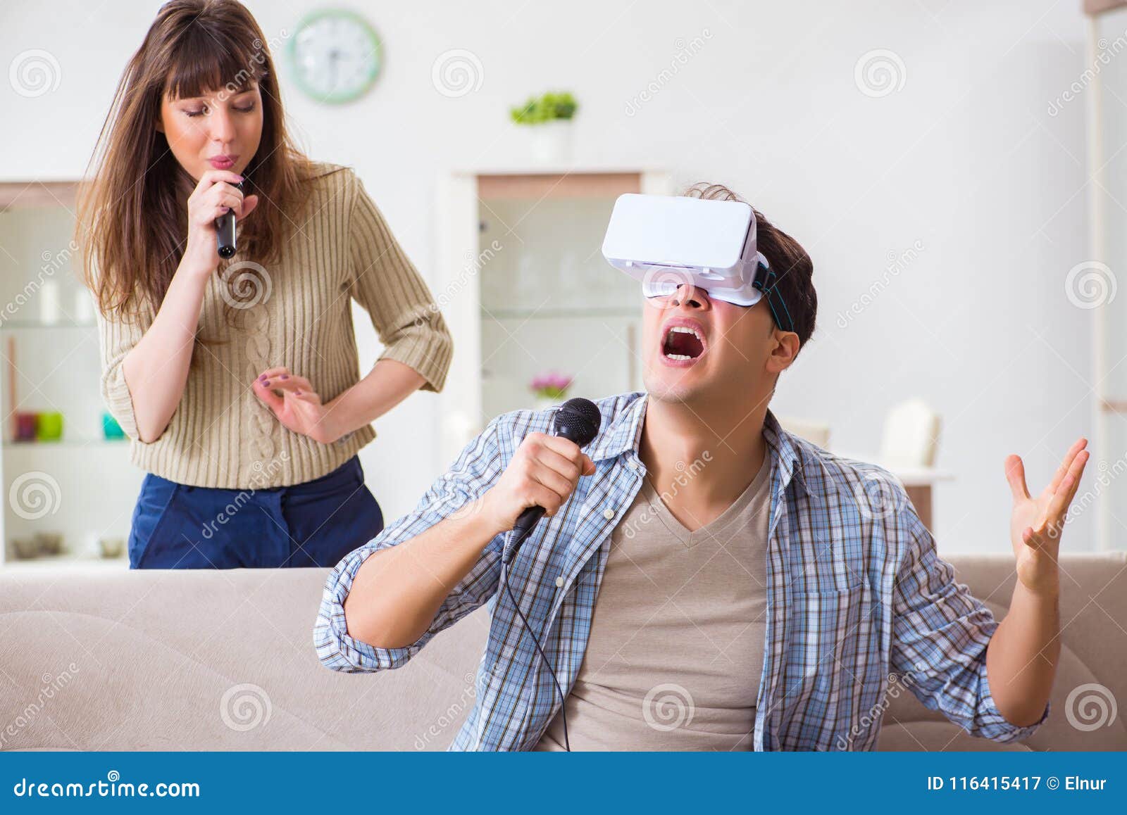 The Pair Singing Karaoke with Virtual Reality Glasses Stock Image