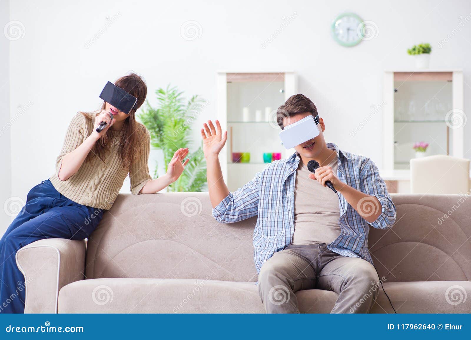 The Pair Singing Karaoke with Virtual Reality Glasses Stock Photo