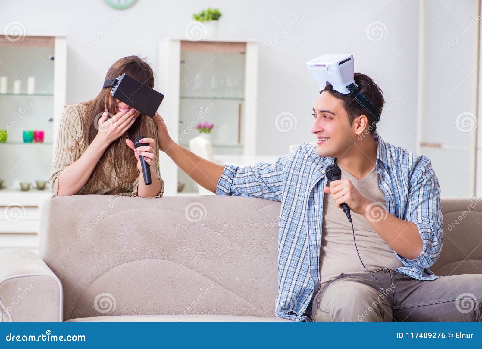 The Pair Singing Karaoke with Virtual Reality Glasses Stock Photo