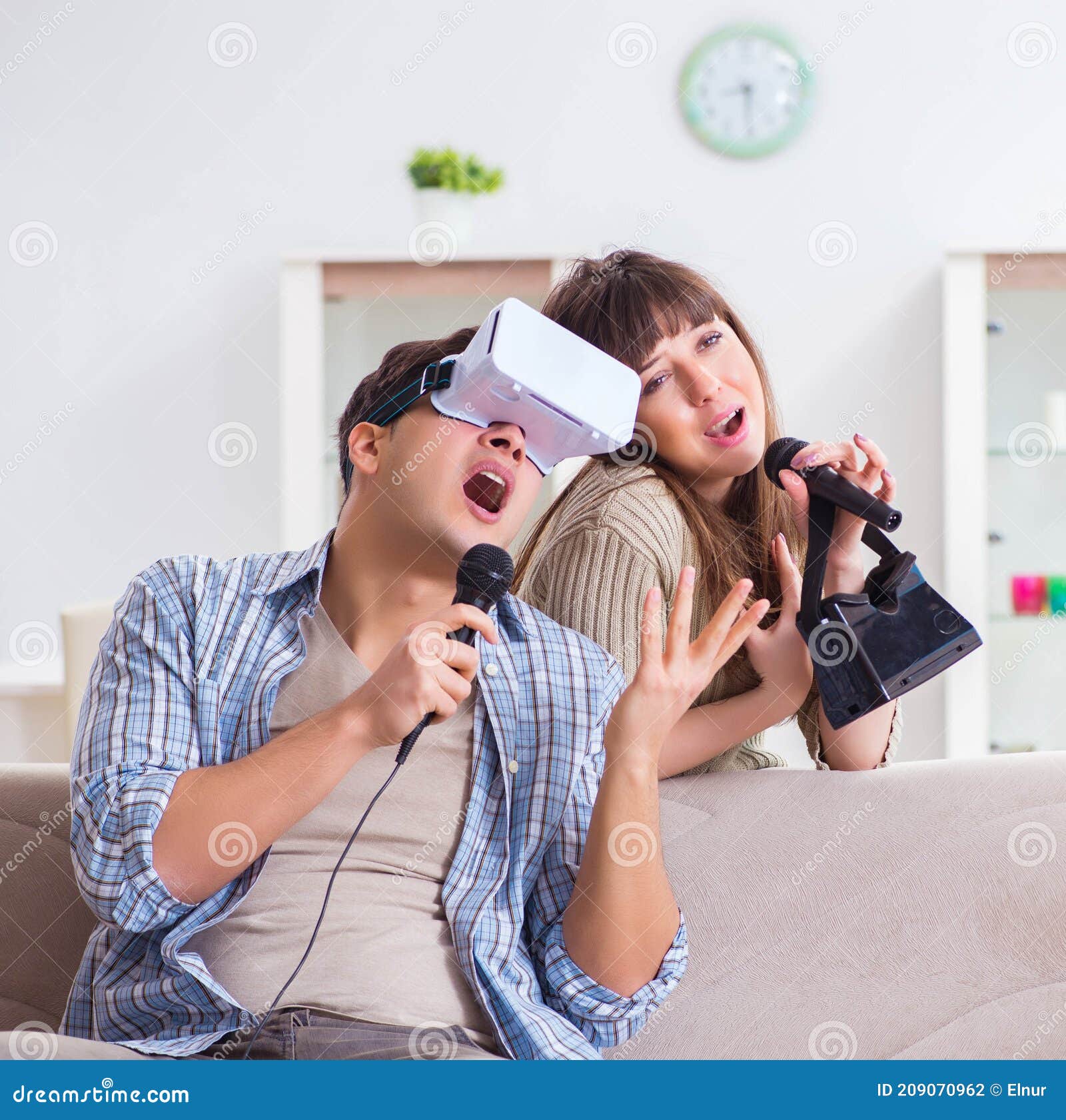 Pair Singing Karaoke with Virtual Reality Glasses Stock Photo Image