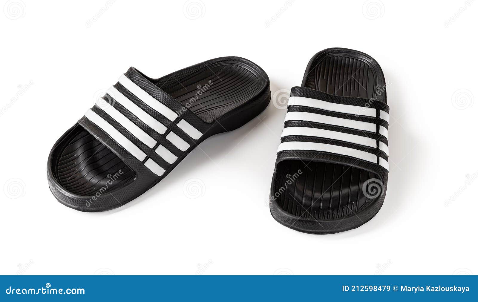 pair of slide sandals  on white. black rubber slippers closeup. light shoes for pool or shower. comfortable beach flip