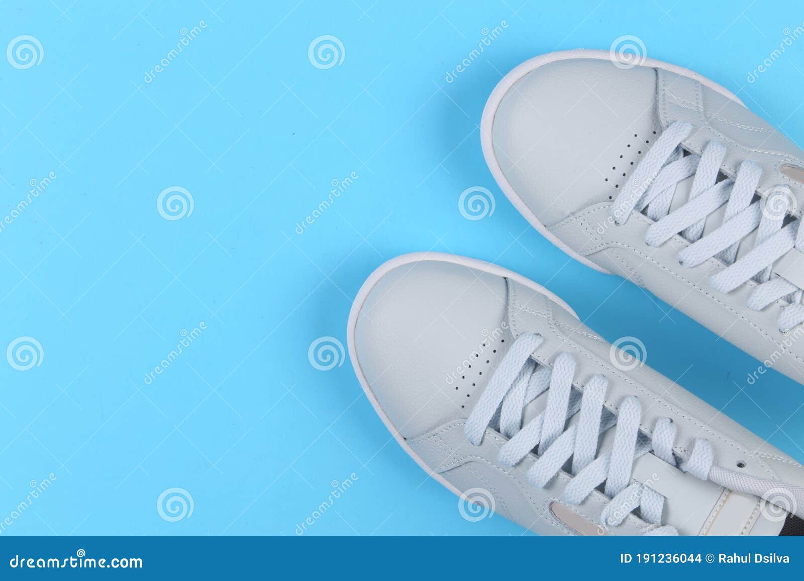 Pair of Sport Shoes on Colorful Background. New Sneakers Blue Pastel ...