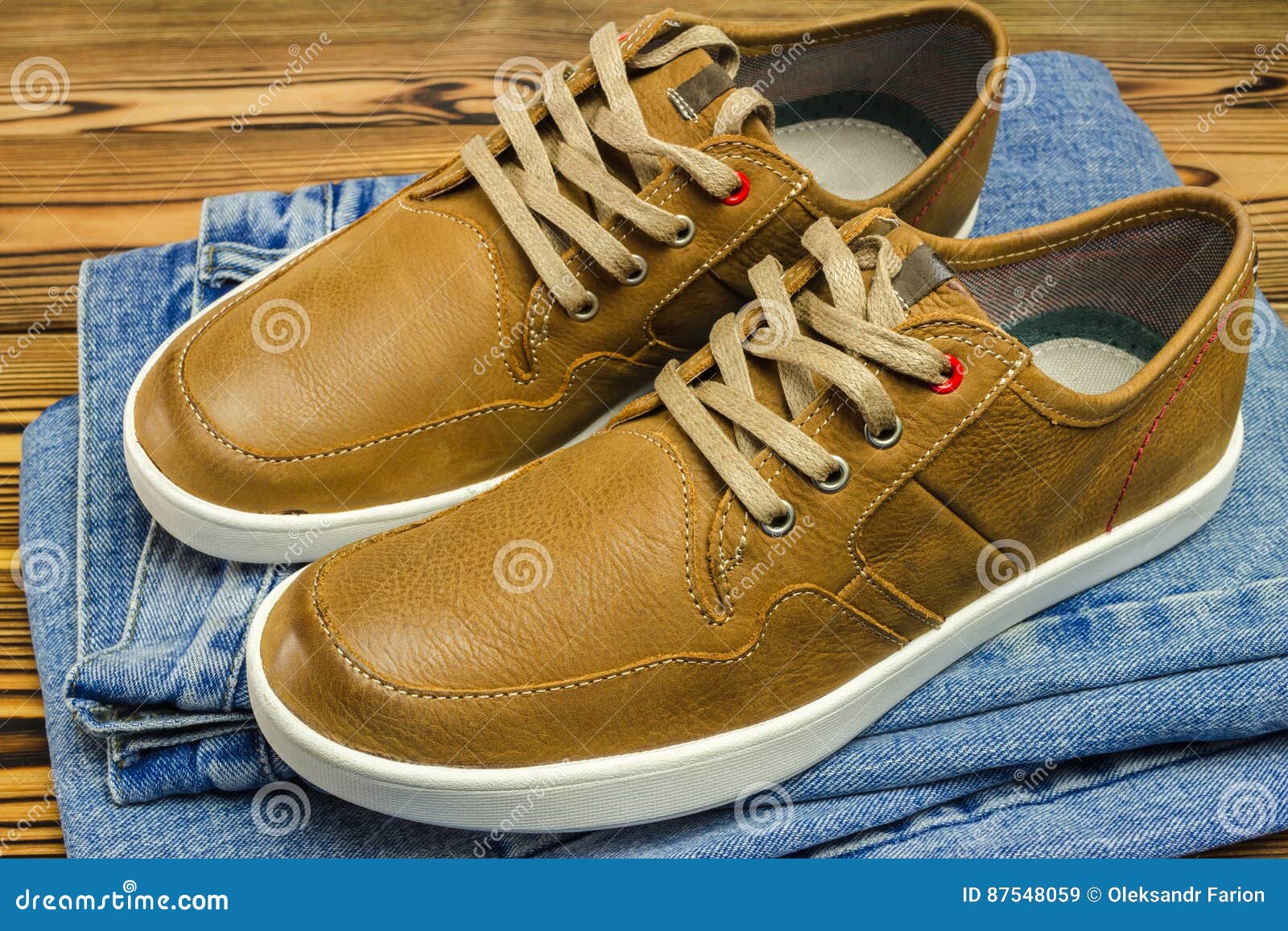 Pair of Tan Color, Leather Sneakers on Jeans Pant, Wooden Background. Stock  Image - Image of classic, trendy: 87548059