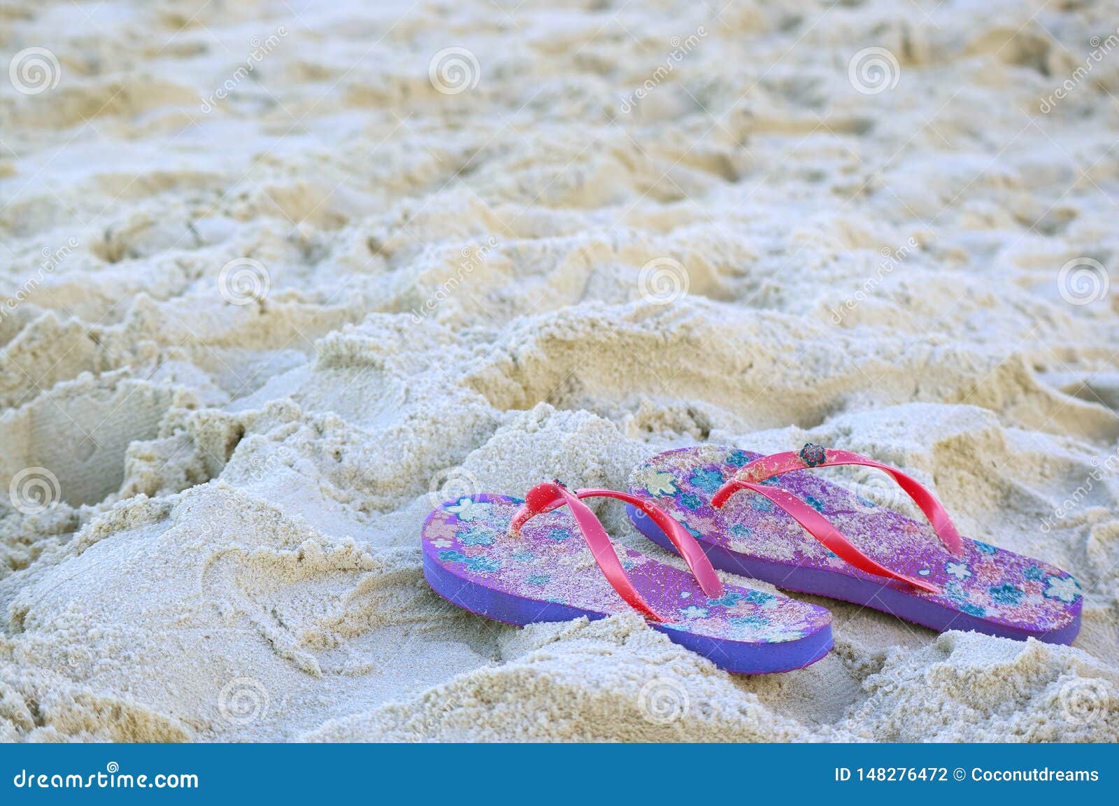 Pair of Vivid Colored Flip-flops Sandals on the Sandy Beach Stock Photo ...