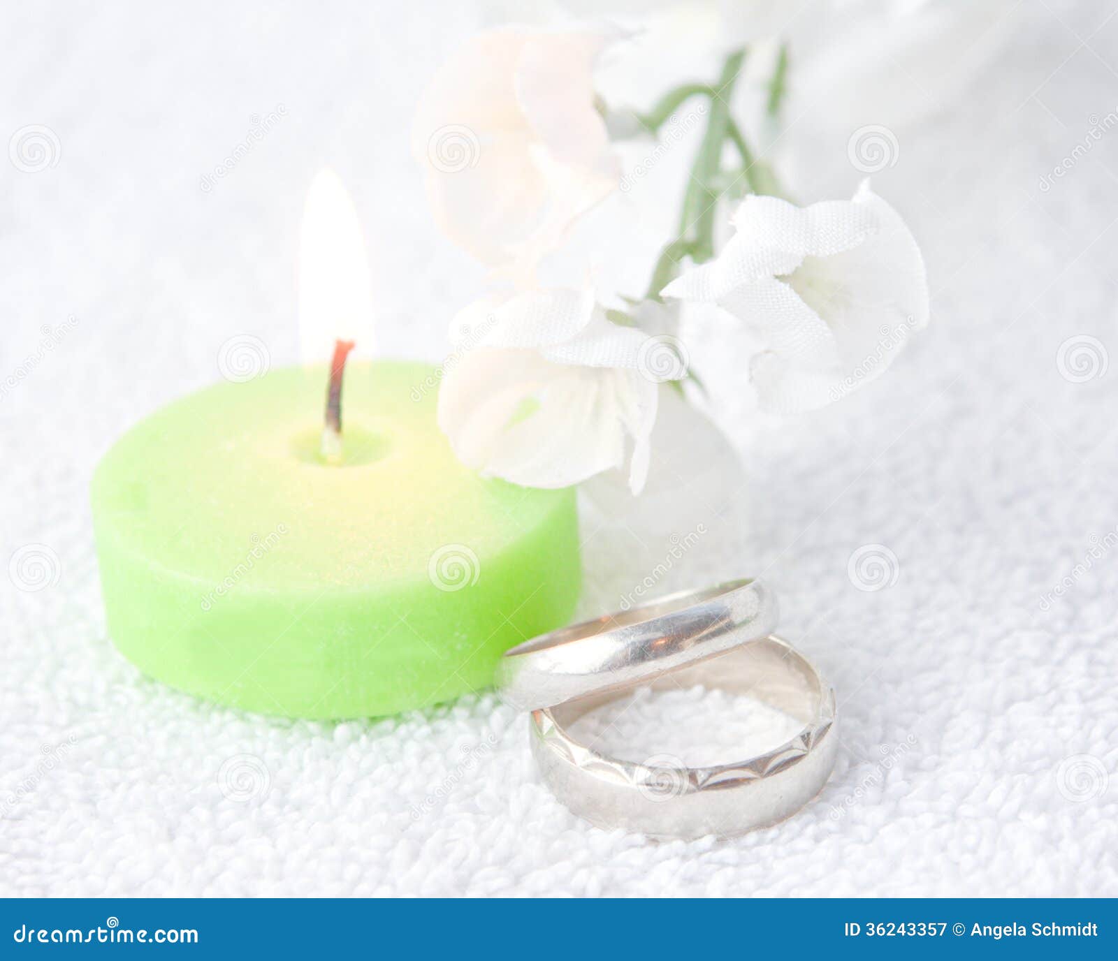Pair of Wedding Rings with Lit Green Candle Stock Image Image of