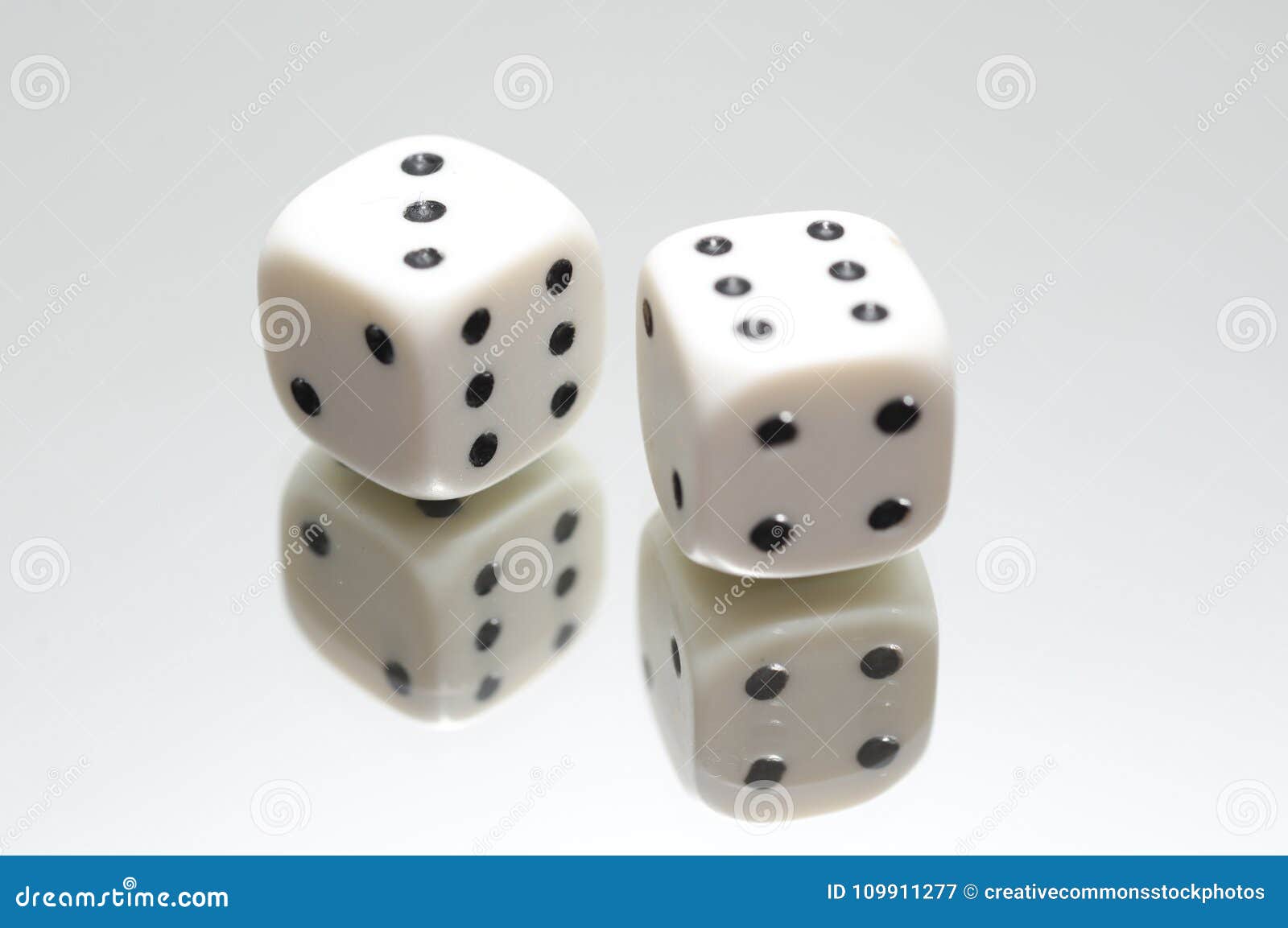 Pair Of White Dice On Top Of Mirror Picture. Image 109911277