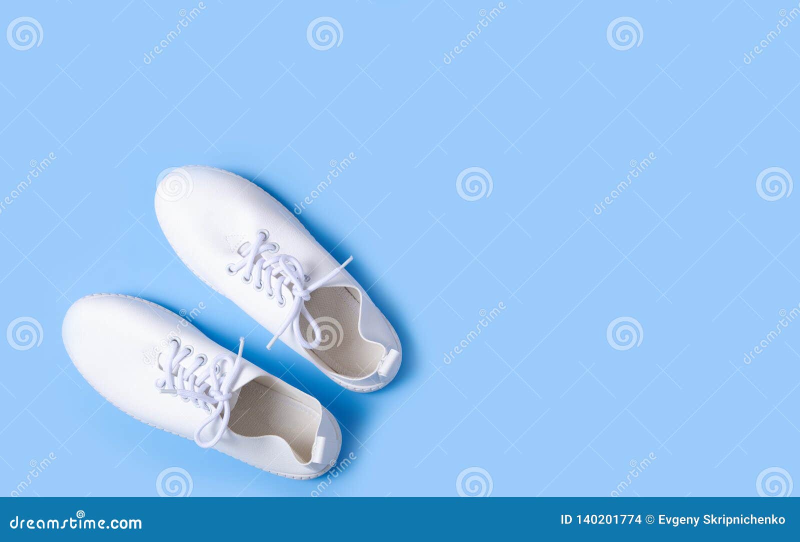 Pair of white sneakers stock photo. Image of comfortable - 140201774