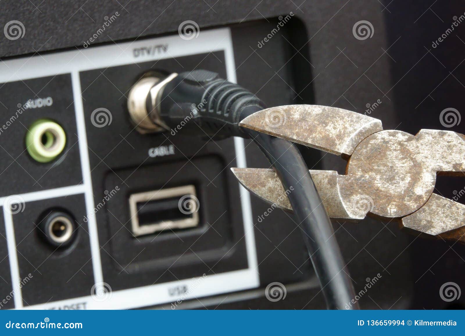 cutting the cable tv cord with a wire cutter tool