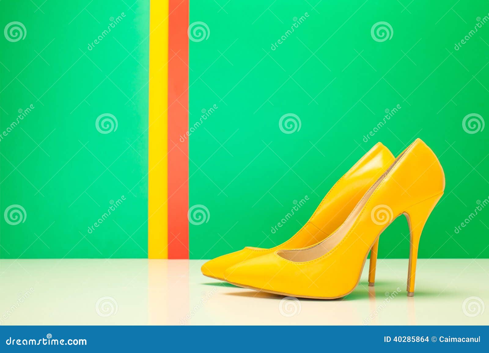 Pair of yellow high heels stock photo. Image of glamour 40285864