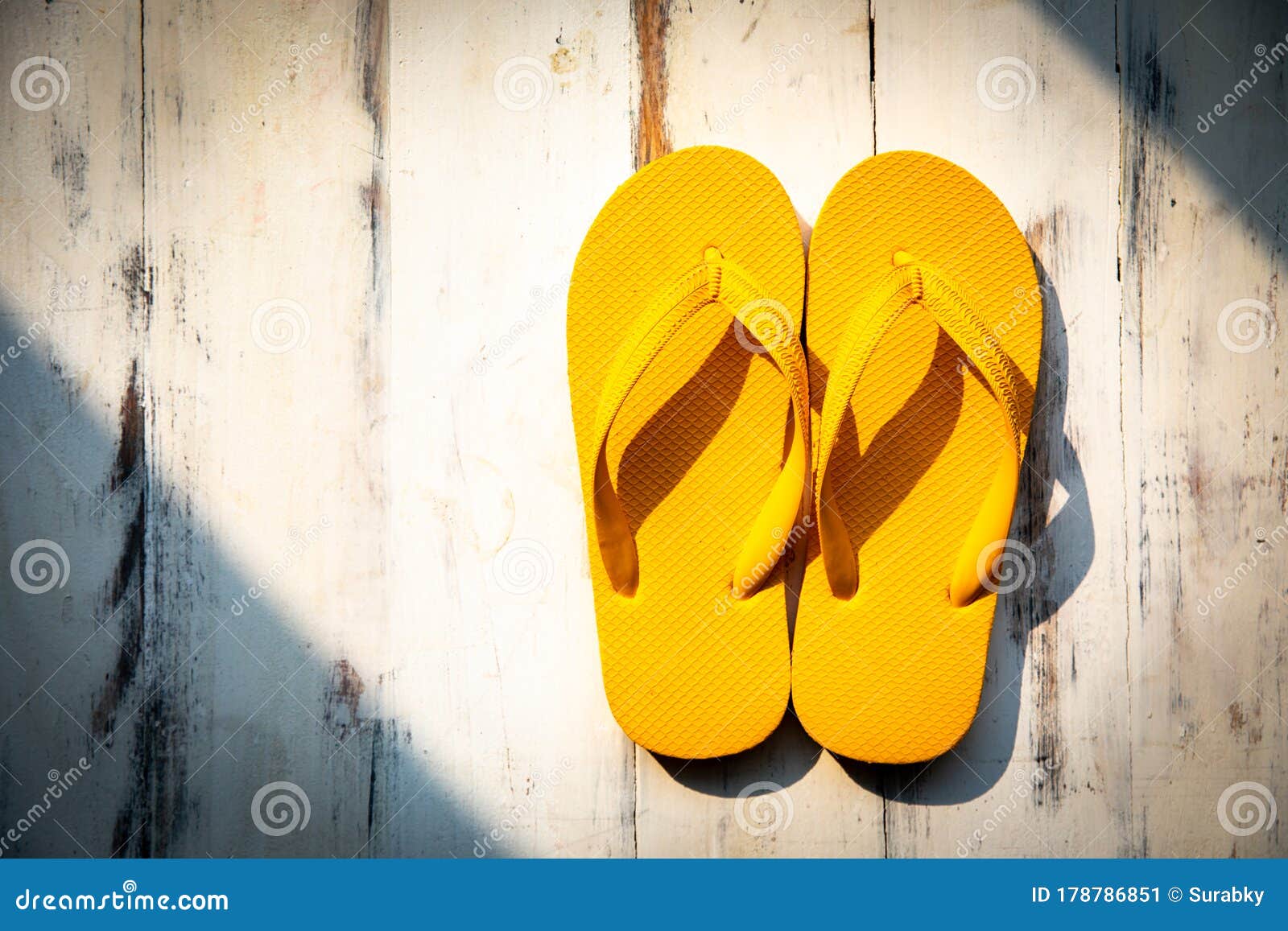 Pair of Yellow Slippers on Wood Background Image - Image of fashion, rubber: 178786851