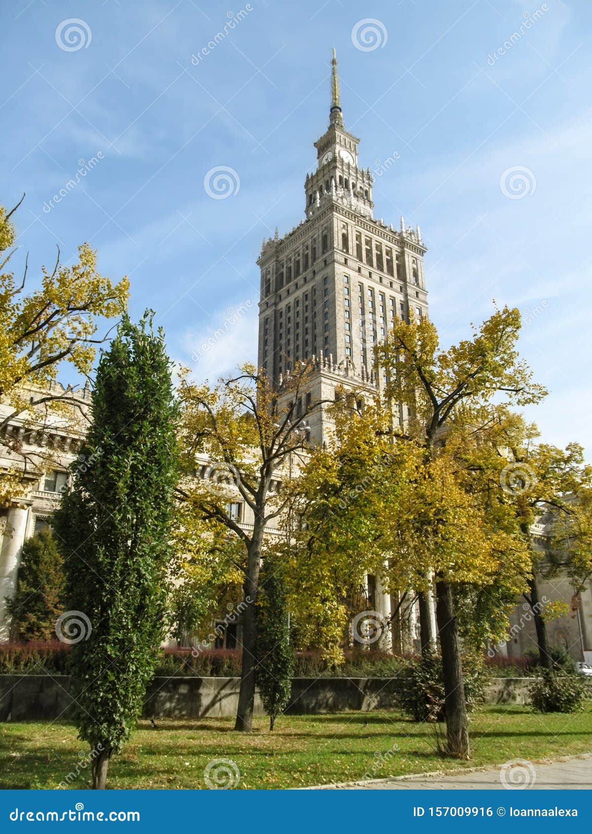 palace of culture and science pkin on a sunny autumn day in center of warsaw, poland. clock tower of tallest building in poland