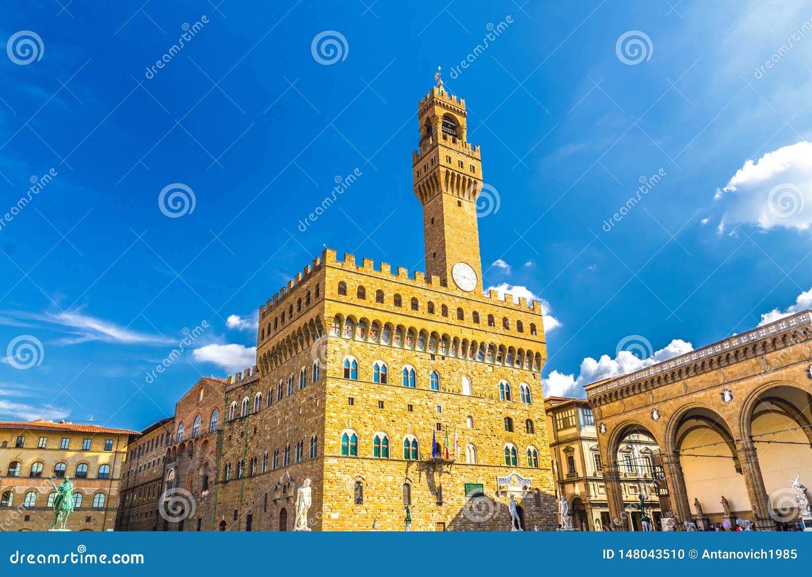palazzo vecchio palace with bell tower with clock and loggia dei lanzi on piazza della signoria square in historical centre of flo