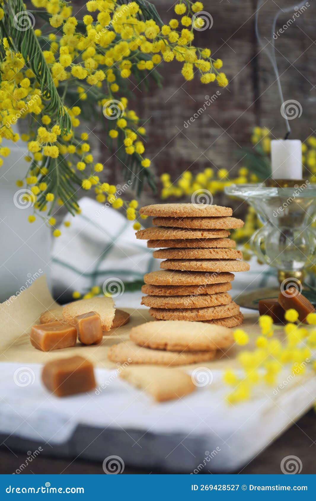 palets bretons, french cookies. salted caramel shortbread breton cookies and bouquet of mimosa